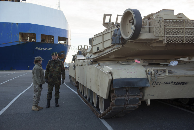 epa05701338 Josef Blotz (R), Major General of the German Army talks to a soldier of the U.S. Army in front of the cargo vessel 'Resolve' in Bremerhaven, northern Germany, 06 January 2017. More than 2,500 tanks, trucks and other vehicles of the US Army will be handled in Bremerhaven during what is the biggest troop transfer from the US to Europe since the end of the Soviet Union. The US equipment will be transported to Poland on some 900 railway waggons for the military excercise Atlantic Resolve. EPA/DAVID HECKER