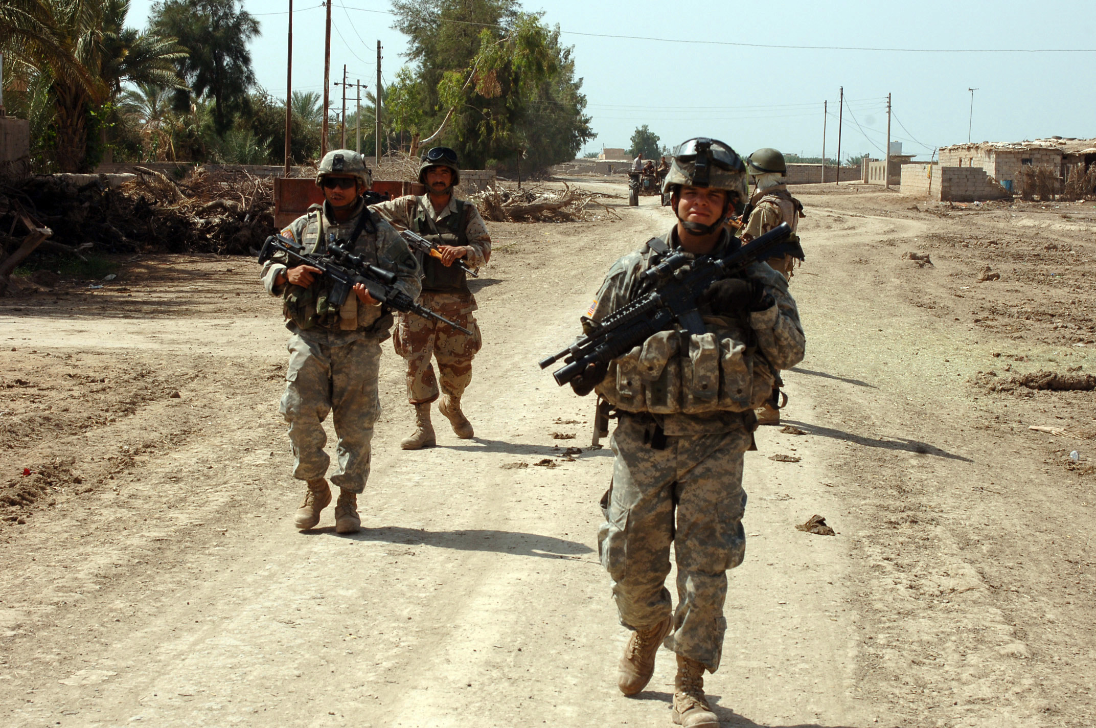 Members of B Company, 1-502nd Infantry Battalion, 101st Airborne Division conduct a patrol during Operation Desert Scorpion. The operation is an effort to disrupt terrorist activities near Rushdie Mula, Iraq. The photo was taken on the afternoon of April 20, 2006 as part of Operation Iraqi Freedom. (U.S. Army photo by Sgt. 1st Class David D. Isakson) (Released)