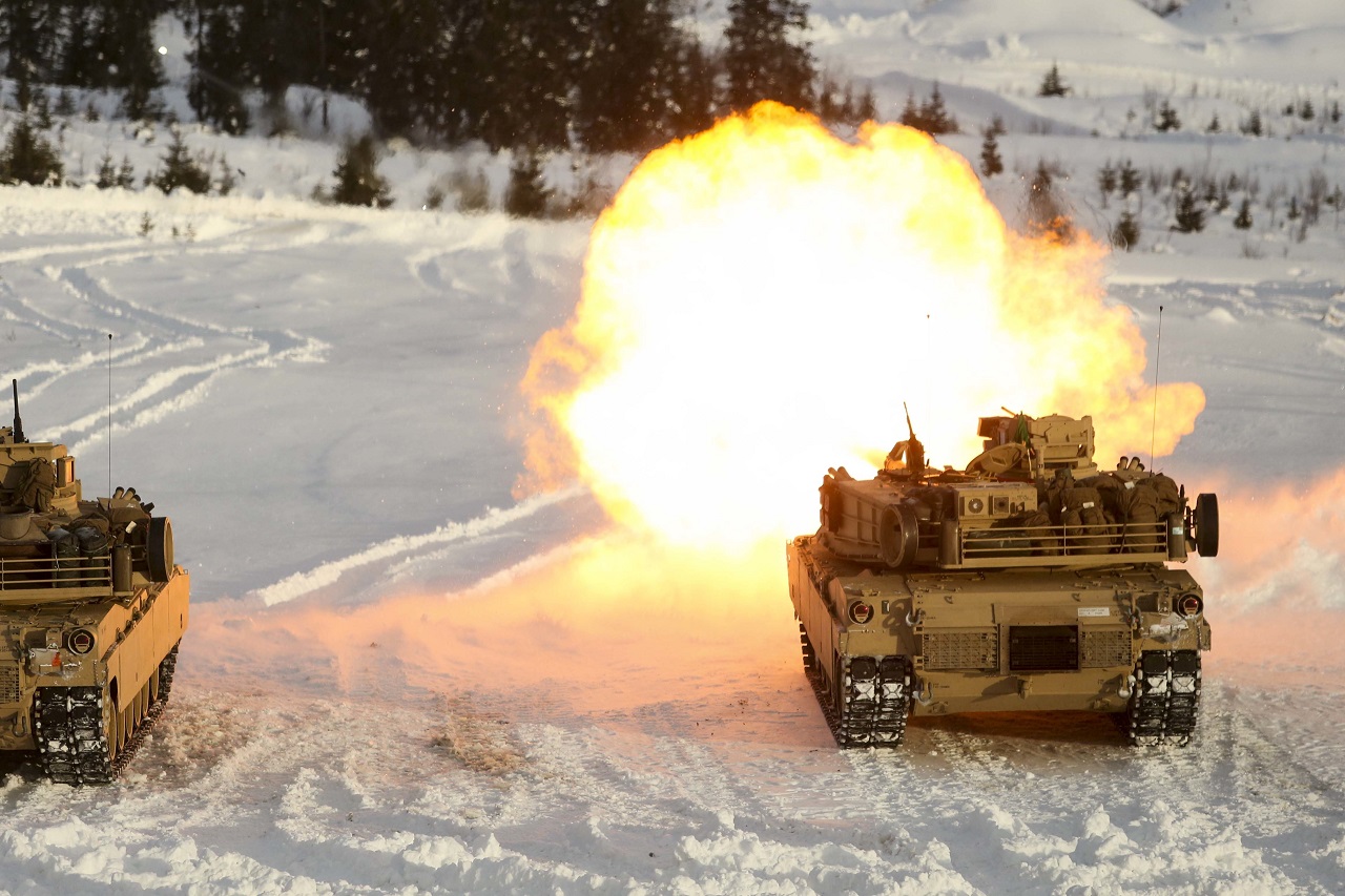 A U.S. Marine Corps M1A1 Abrams Tank creates some warmth as it takes part in a live-fire exercise in Rena, Norway, Feb. 18, 2016. Tanks with Combined Arms Company took to the firing line as part of a training exercise integrating both U.S. and Norwegian forces. The Marines and Norwegians are preparing themselves for Exercise Cold Response 16, which will bring together 12 NATO allies and partner nations and approximately 16,000 troops in order to enhance joint crisis response capabilities in cold weather environments. (U.S. Marine Corps photo by Cpl. Dalton A. Precht/released)