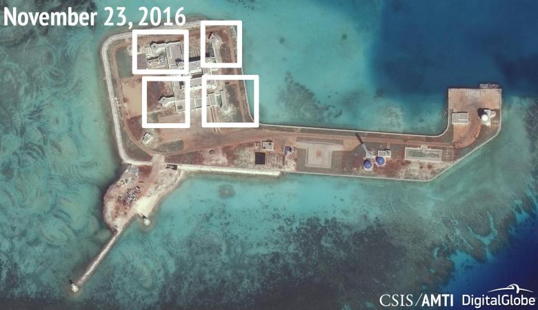 A satellite image shows what CSIS Asia Maritime Transparency Initiative says appears to be anti-aircraft guns and what are likely to be close-in weapons systems (CIWS) on the artificial island Hughes Reef in the South China Sea in this image released on December 13, 2016. Courtesy CSIS Asia Maritime Transparency Initiative/DigitalGlobe/Handout via REUTERS