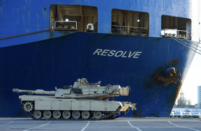 epa05701334 A tank of the United States Army in front of the cargo vessel 'Resolve' in Bremerhaven, northern Germany, 06 January 2017. More than 2,500 tanks, trucks and other vehicles of the US Army will be handled in Bremerhaven during what is the biggest troop transfer from the US to Europe since the end of the Soviet Union. The US equipment will be transported to Poland on some 900 railway waggons for the military excercise Atlantic Resolve. EPA/DAVID HECKER